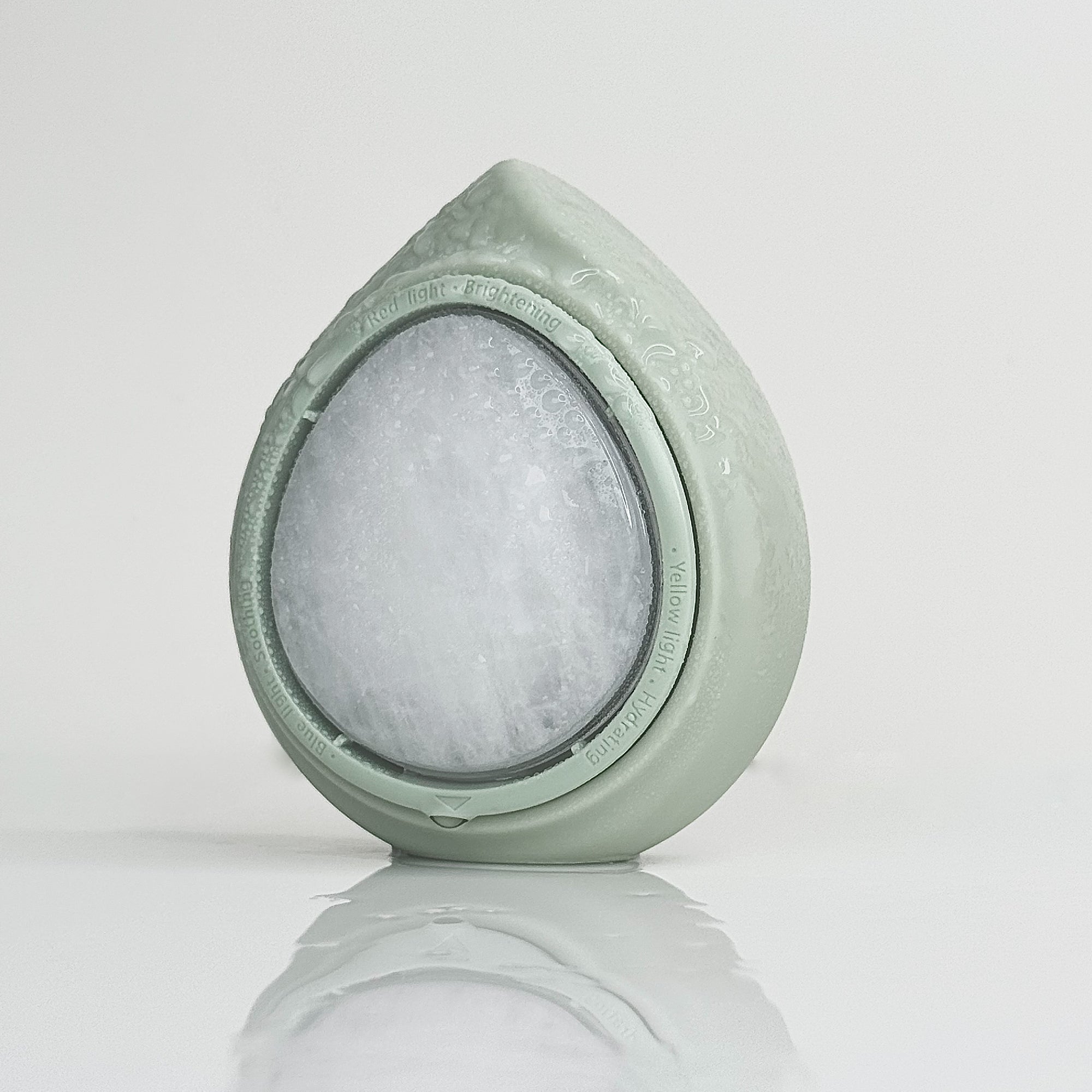Haumea LED TRI-BOOSTER light therapy mask device with red, yellow and blue LED modes and jade stone base